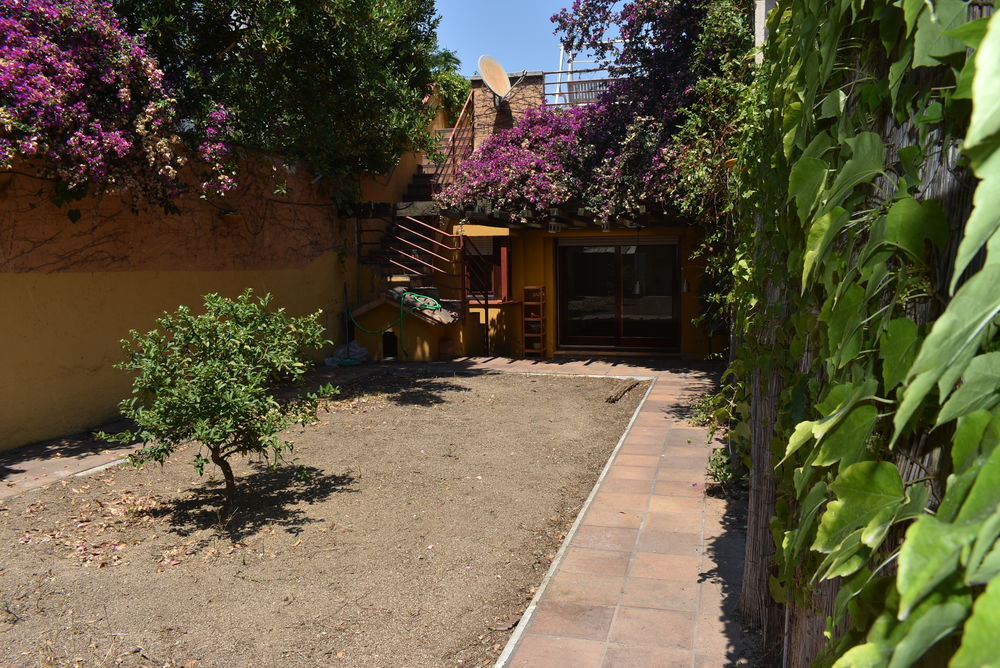 Agradable casa amb jardí privat i terrassa solàrium a la part de dalt